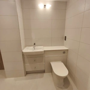 white sink and tiles in a bathroom